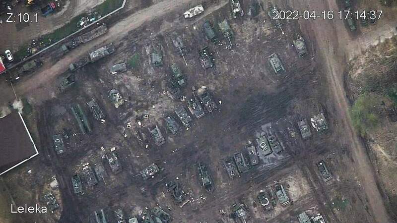 56915529-10742425-Drone_images_have_revealed_huge_graveyards_of_the_charred_milita-a-71_1650617528652.jpg